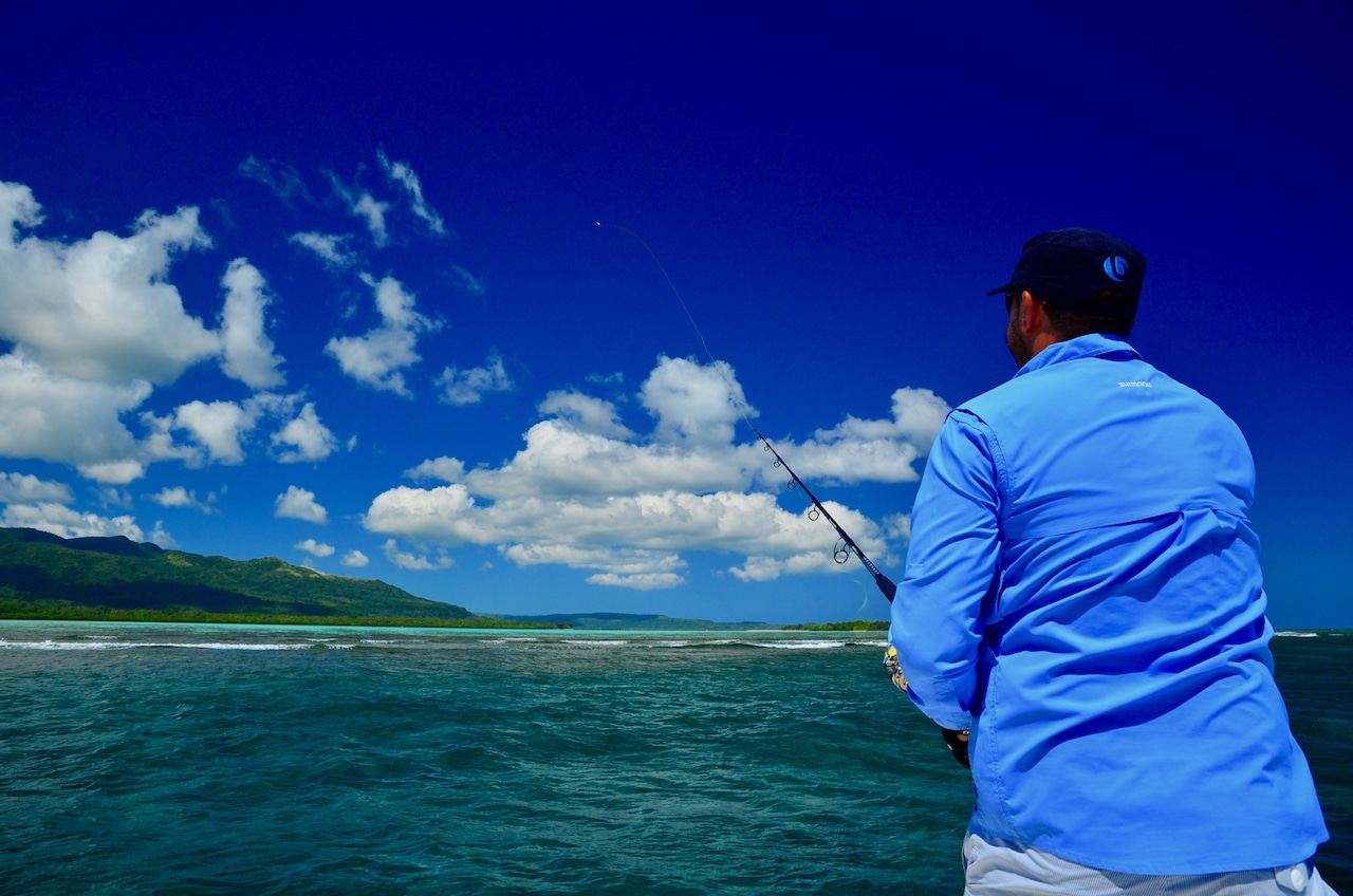 Angler casting the reef fringes for giant trevally.