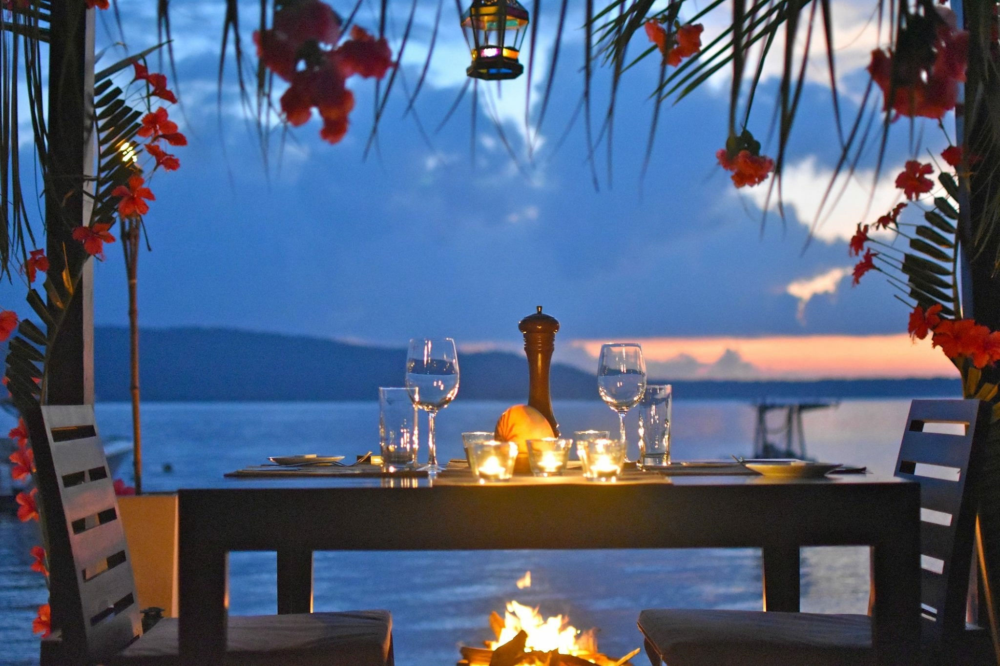 Dining setup by the waterfront at Trees and Fishes Private Retreat.