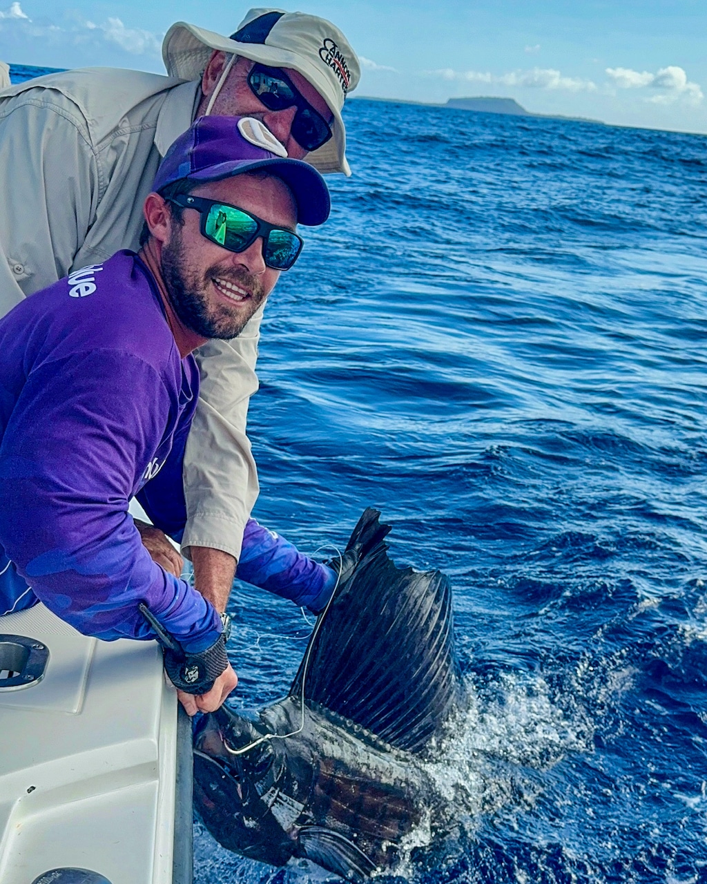 Guide tracing a sailfish at the boat in Vanuatu.