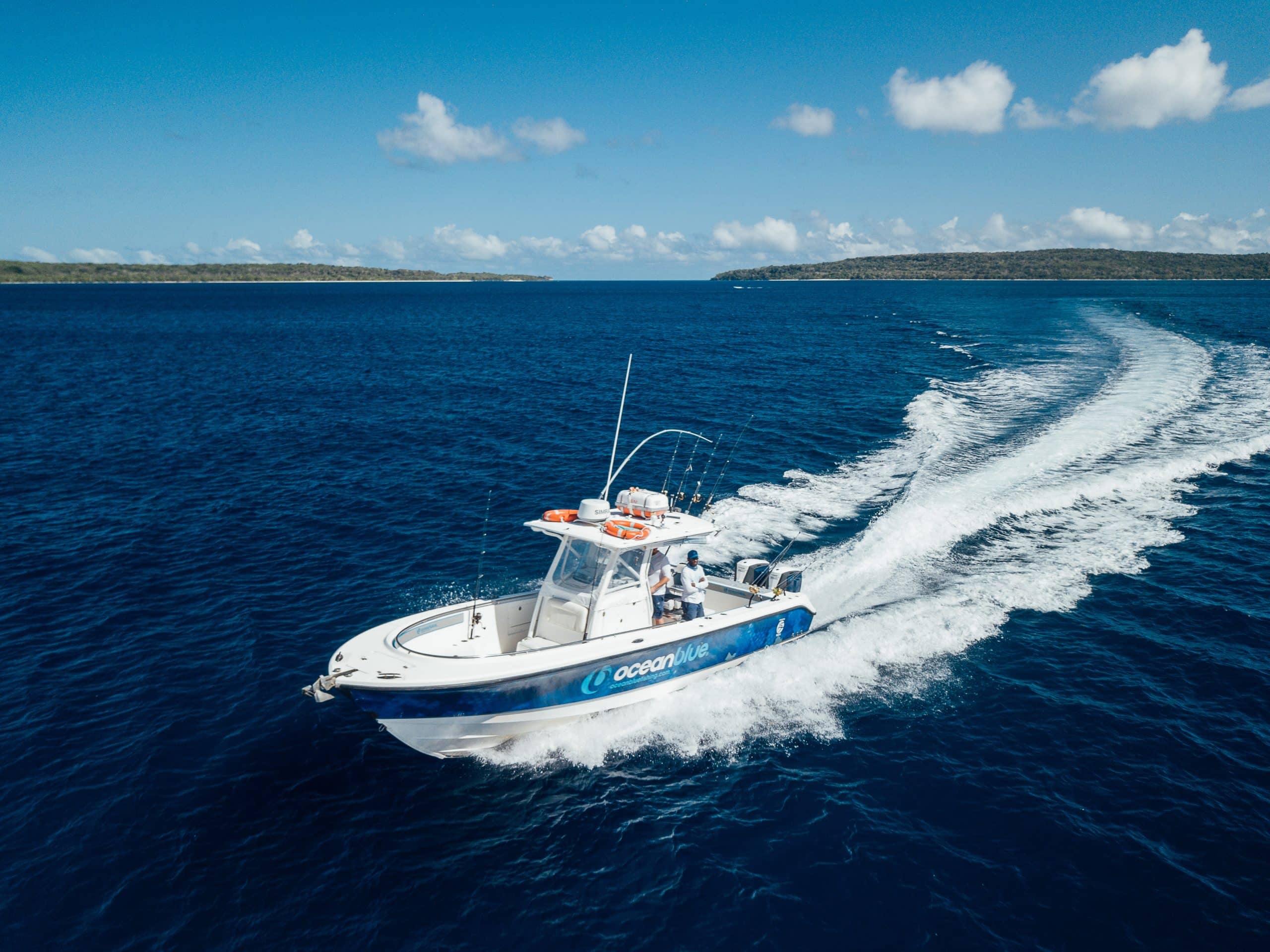 Sport fishing boat on clear blue waters during an overseas fishing adventure.