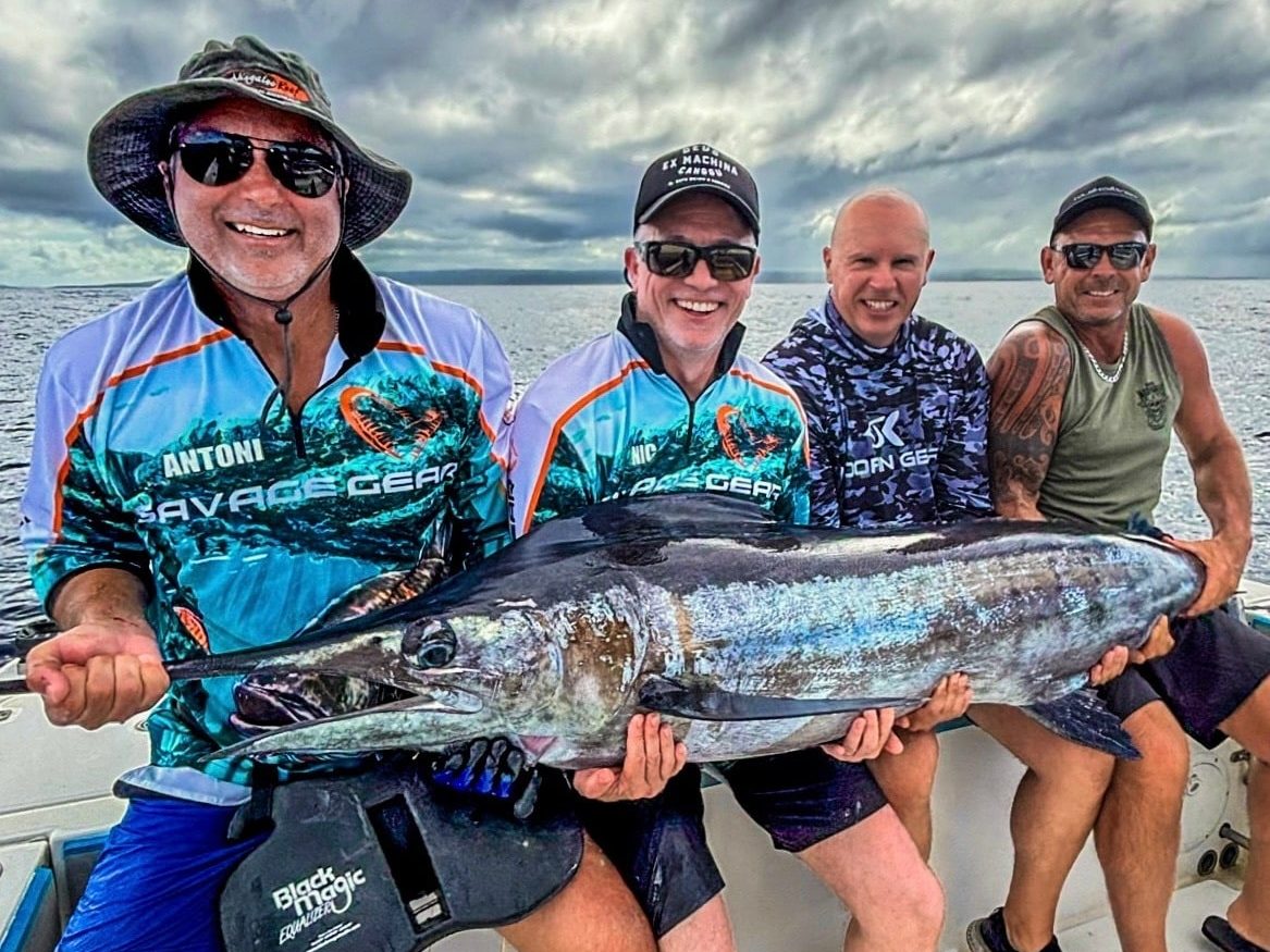 Four mates stoked with their solid Vanuatu marlin