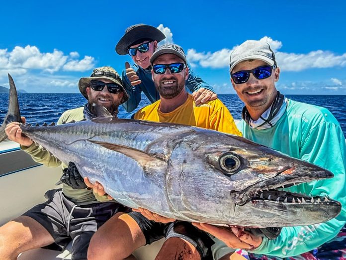 Group of mates holding a nice Vanuatu dogtooth tuna